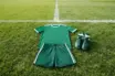 Football training kit on green grass pitch representing Celtic transfer opportunity