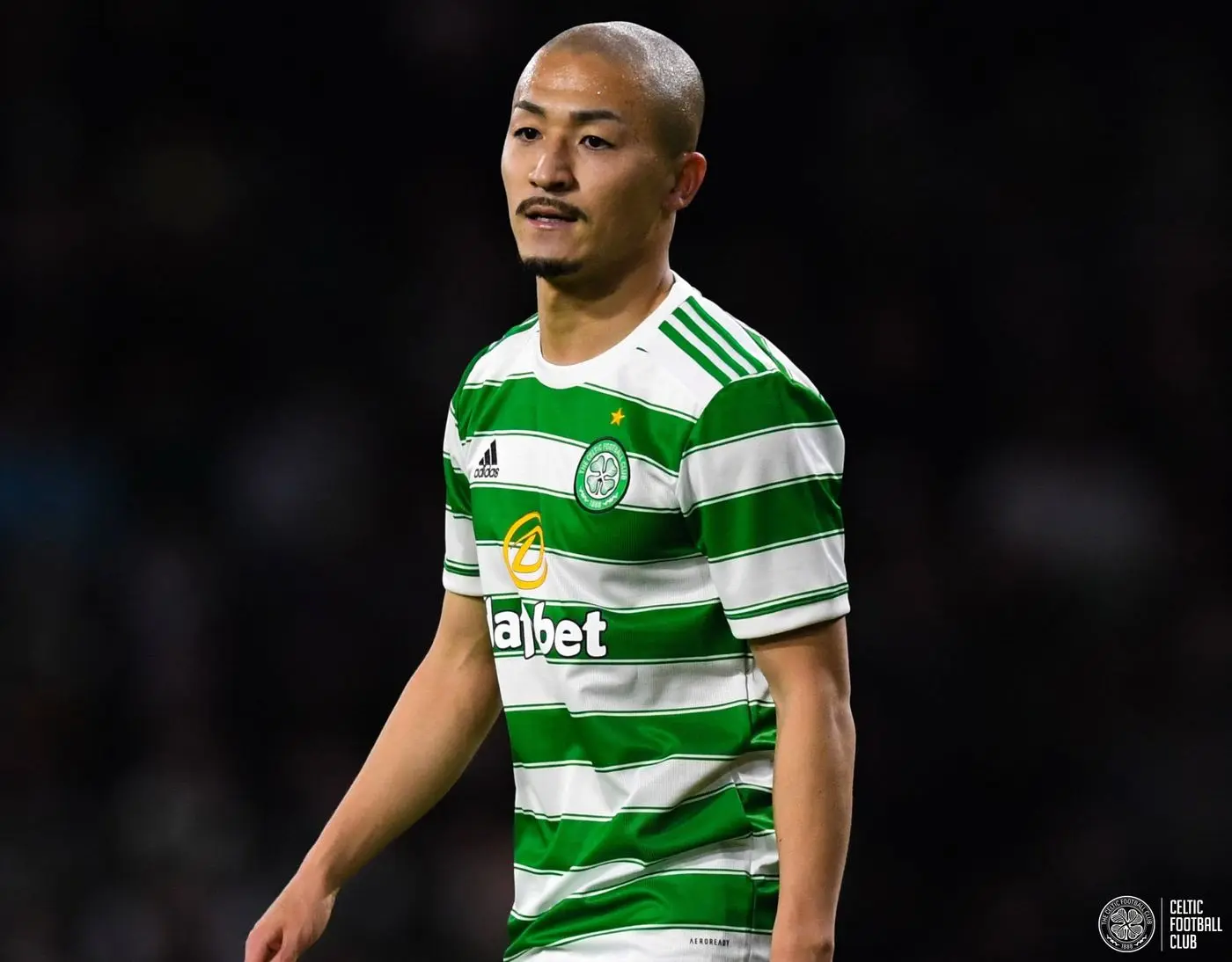 Daizen Maeda in a green and white hooped Celtic FC home kit