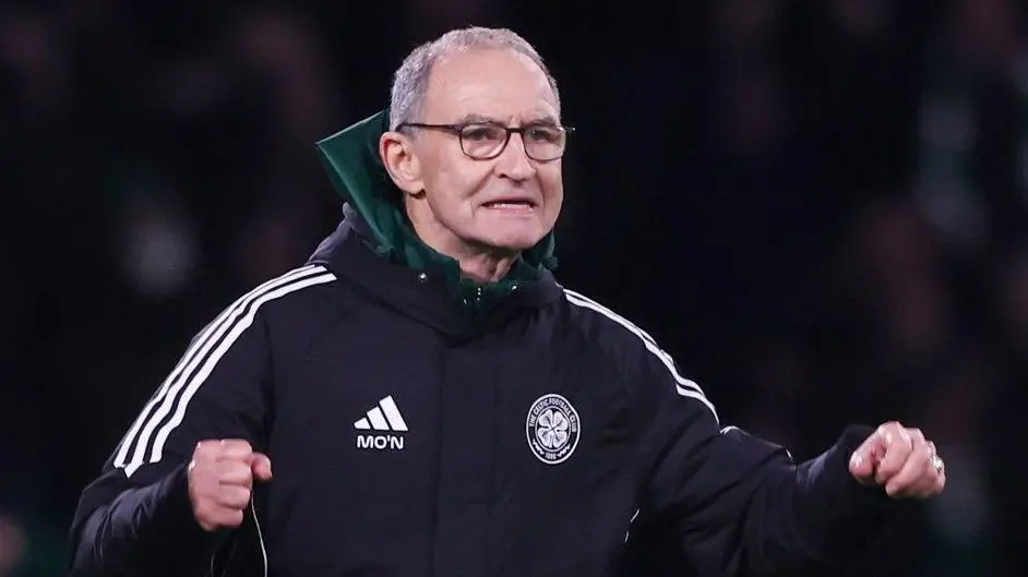 Celtic manager Martin O'Neill celebrating on the sidelines during a match.