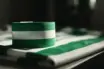 Celtic captain's armband in green and white on football jersey symbolizing leadership and commitment