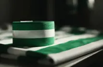 Celtic captain's armband in green and white on football jersey symbolizing leadership and commitment