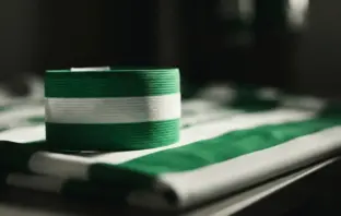 Celtic captain's armband in green and white on football jersey symbolizing leadership and commitment