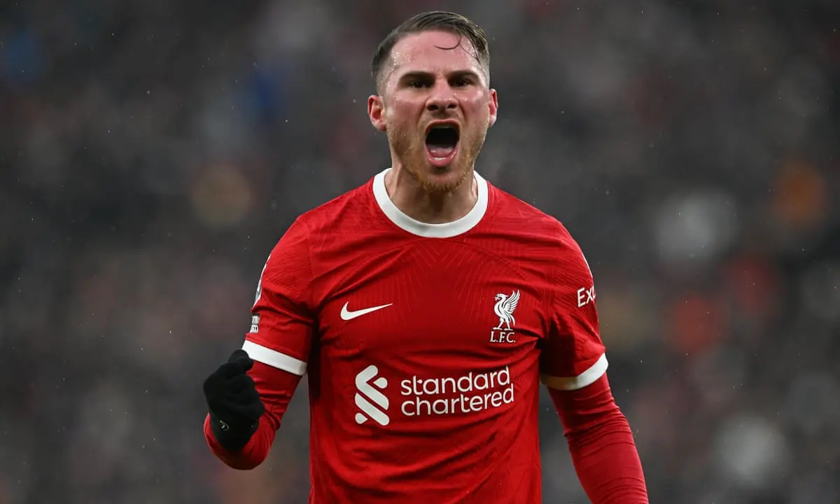 Alexis Mac Allister celebrating in a red Liverpool FC home kit during a match