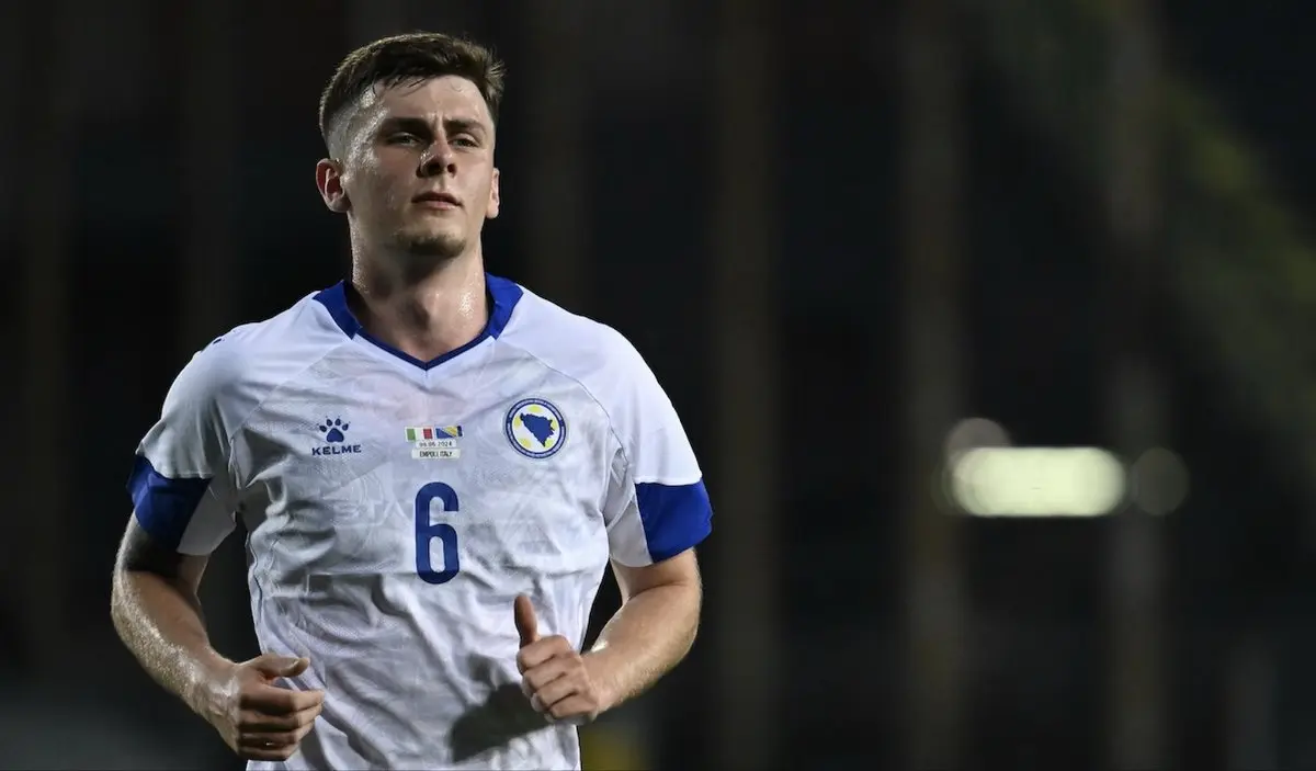 Benjamin Tahirovic wearing the Bosnia and Herzegovina national team white jersey with number 6