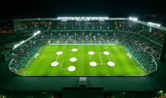 Floodlit football stadium with green-and-white atmosphere representing Celtic’s Europa League league-phase draw