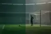 Goalkeeper silhouette in a green kit standing in an empty stadium, symbolising uncertainty over a Celtic transfer target.
