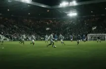 Celtic-inspired team showing disciplined control during a tense floodlit football match