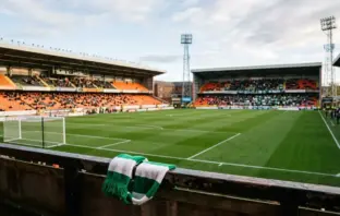Tannadice Park prepared for Celtic’s Scottish League Cup tie in a green-and-white editorial football scene