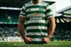 Celtic player in green and white hooped jersey standing ready at Celtic Park stadium
