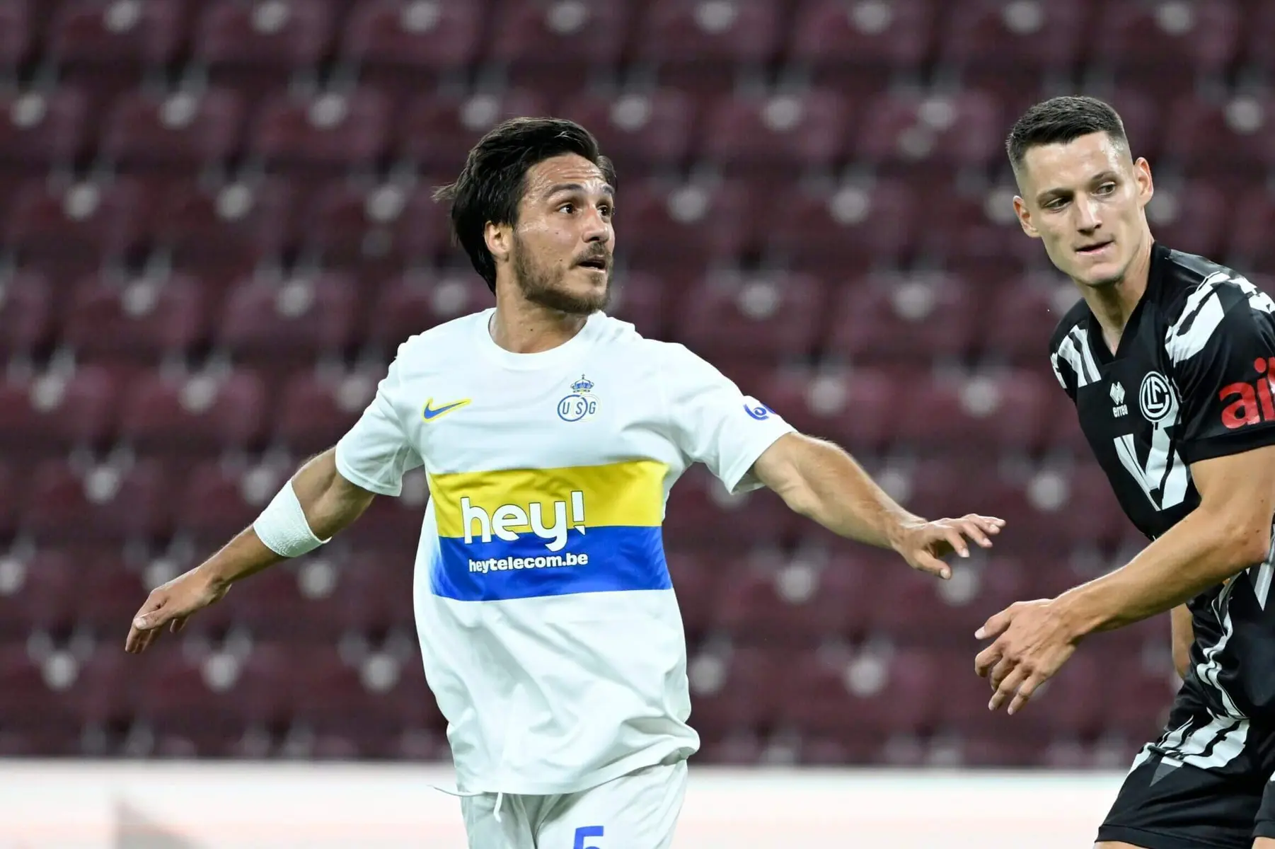 Kevin Mac Allister wearing a white Union Saint-Gilloise jersey during a football match