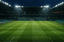 Celtic Park stadium pitch illuminated under floodlights at night before a Champions League match