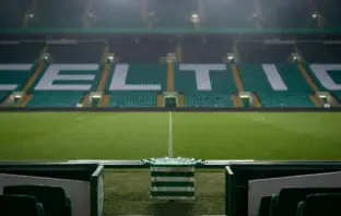 Empty Celtic Park tunnel with a green football shirt suggesting Reo Hatate’s uncertain Celtic future