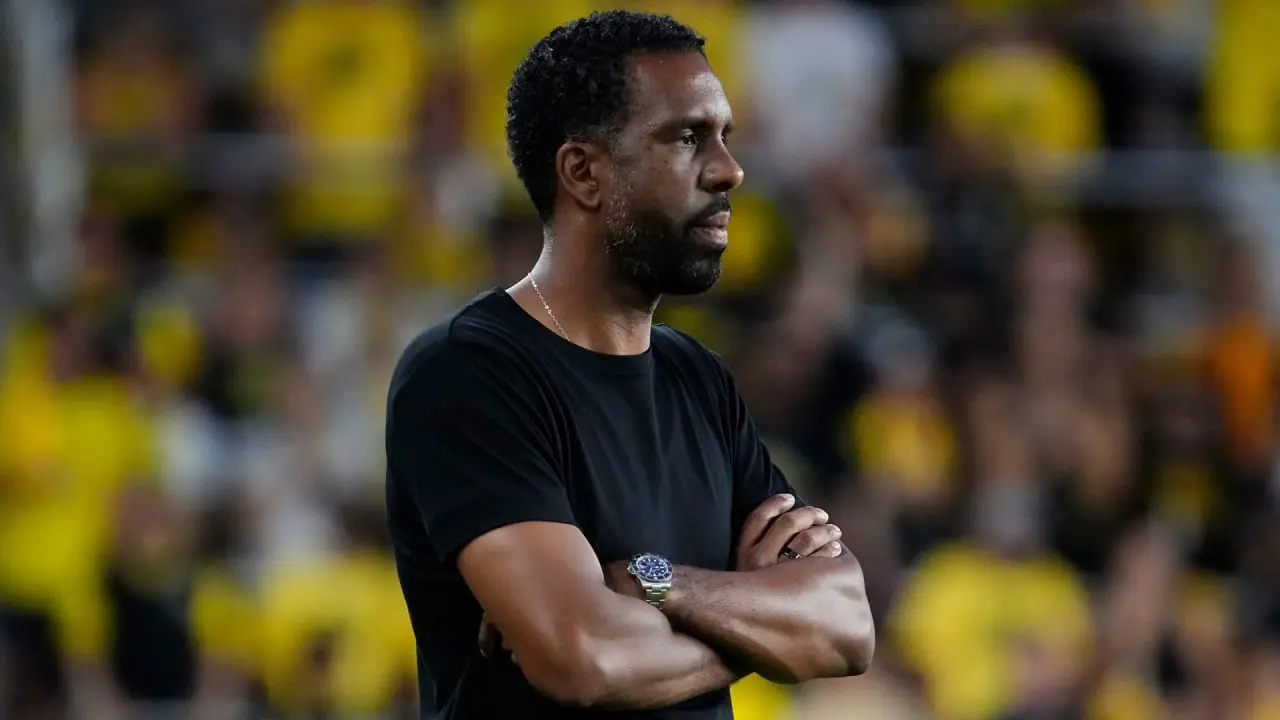 Wilfried Nancy standing with arms crossed on the sidelines during a Columbus Crew match