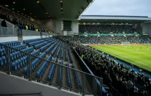 Empty away-support section at a Scottish football derby stadium as travelling fans are barred from fixtures