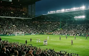 Celtic supporters celebrate a famous European victory over Barcelona at a floodlit Celtic Park