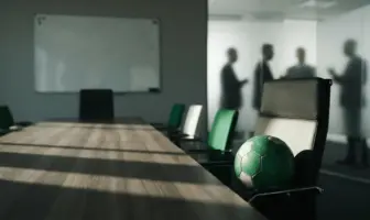 Empty boardroom table and football symbolise Celtic's squad crisis and recruitment failures.