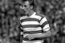 Black and white photo of Tommy Gemmell in a Celtic hooped jersey during a match.