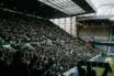 Packed Ibrox home crowd beside an empty away section before the Old Firm cup clash