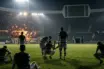 Exhausted Celtic-inspired players react after a dramatic European football collapse under stadium lights