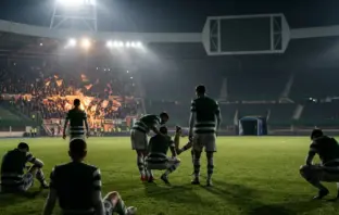 Exhausted Celtic-inspired players react after a dramatic European football collapse under stadium lights