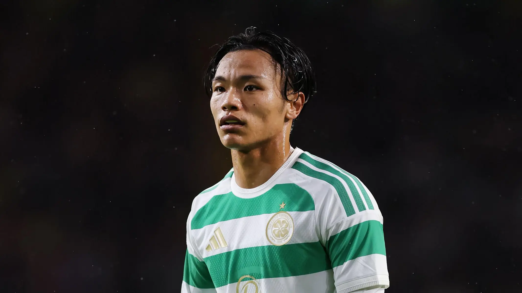 Reo Hatate wearing the green and white hooped Celtic FC home kit