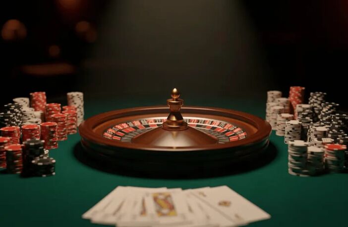 Roulette wheel with stacked casino chips on dark felt table — online gambling risks in Indonesia